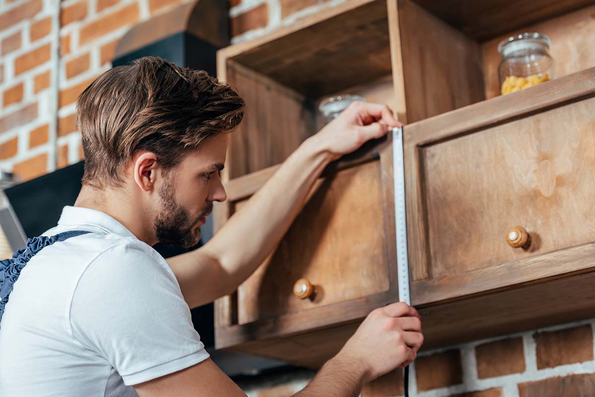 kitchen fitter installing furniture