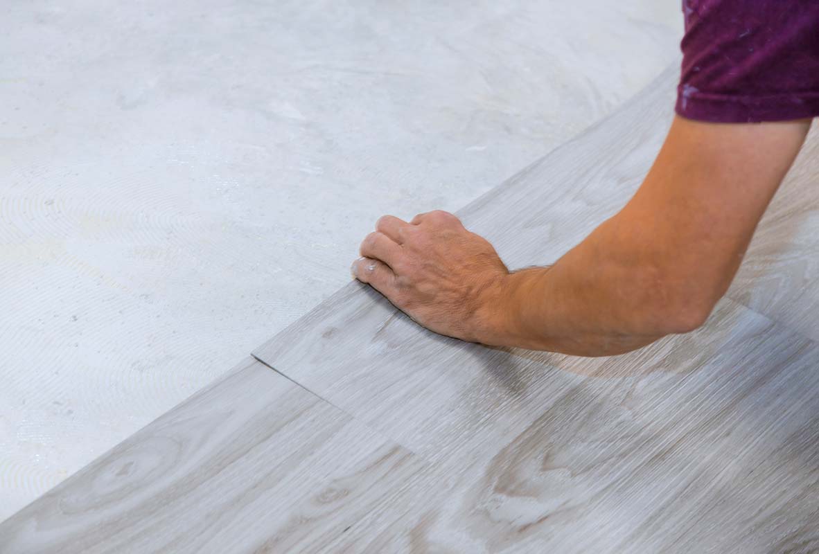 kitchen renovation expert in surrey installing vinyl flooring in kitchen