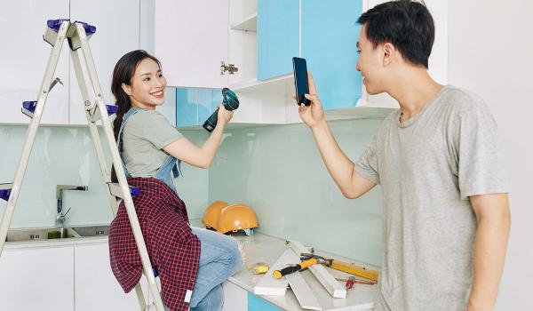 couple doing DIY kitchen renovation