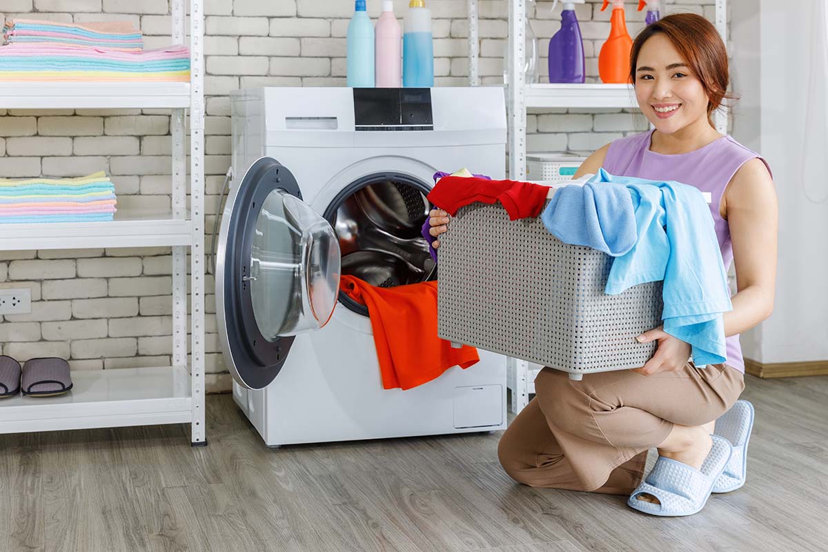 woman in an utility room with laundry