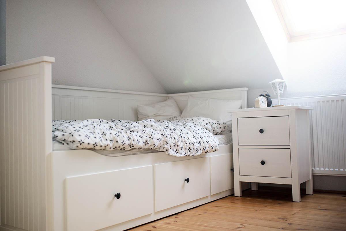 white wooden single bed