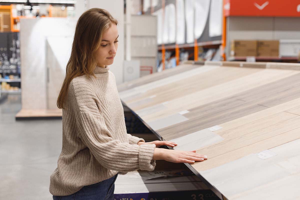 woman choosing laminate flooring for kitchen